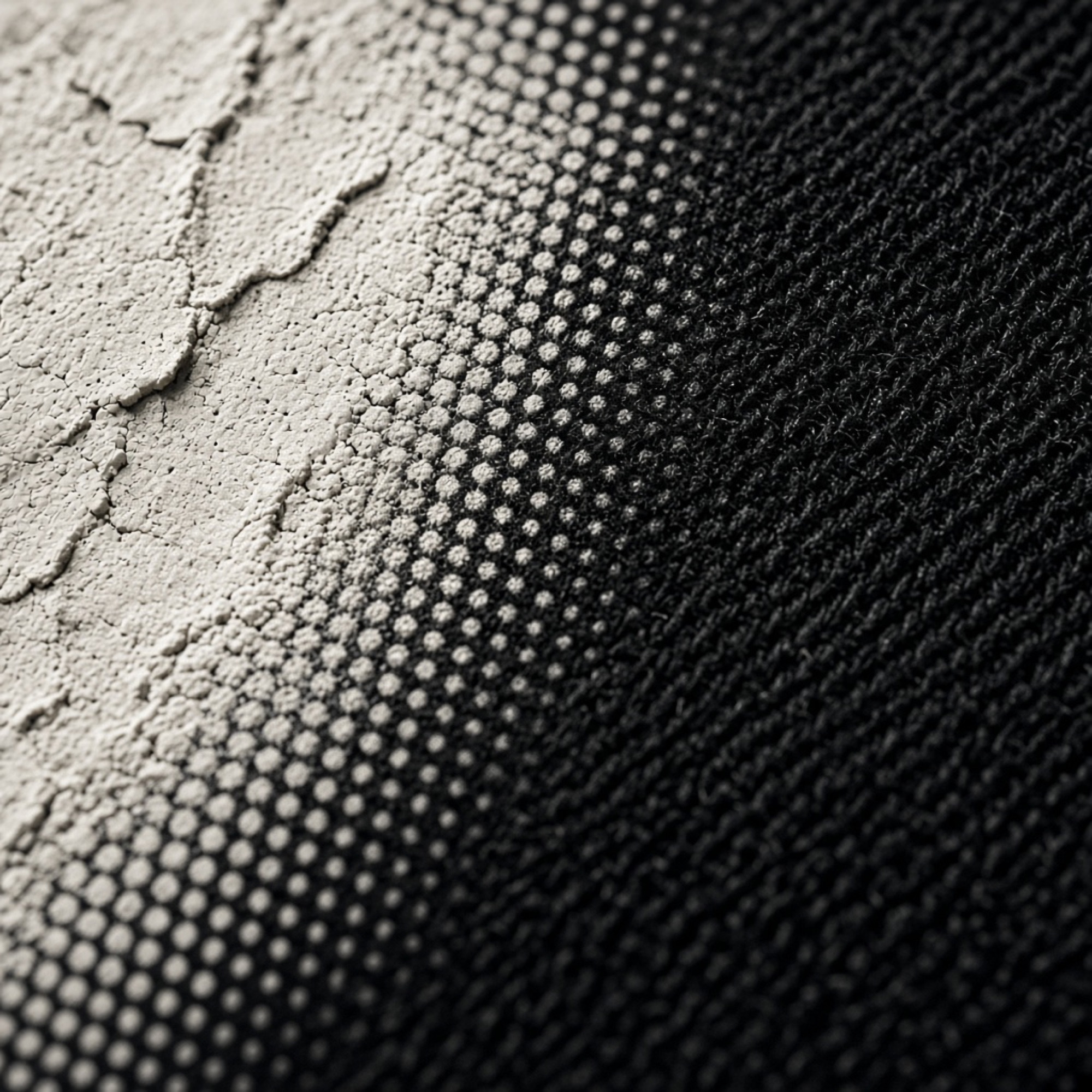 Cracked screen-print ink with halftone on black cotton